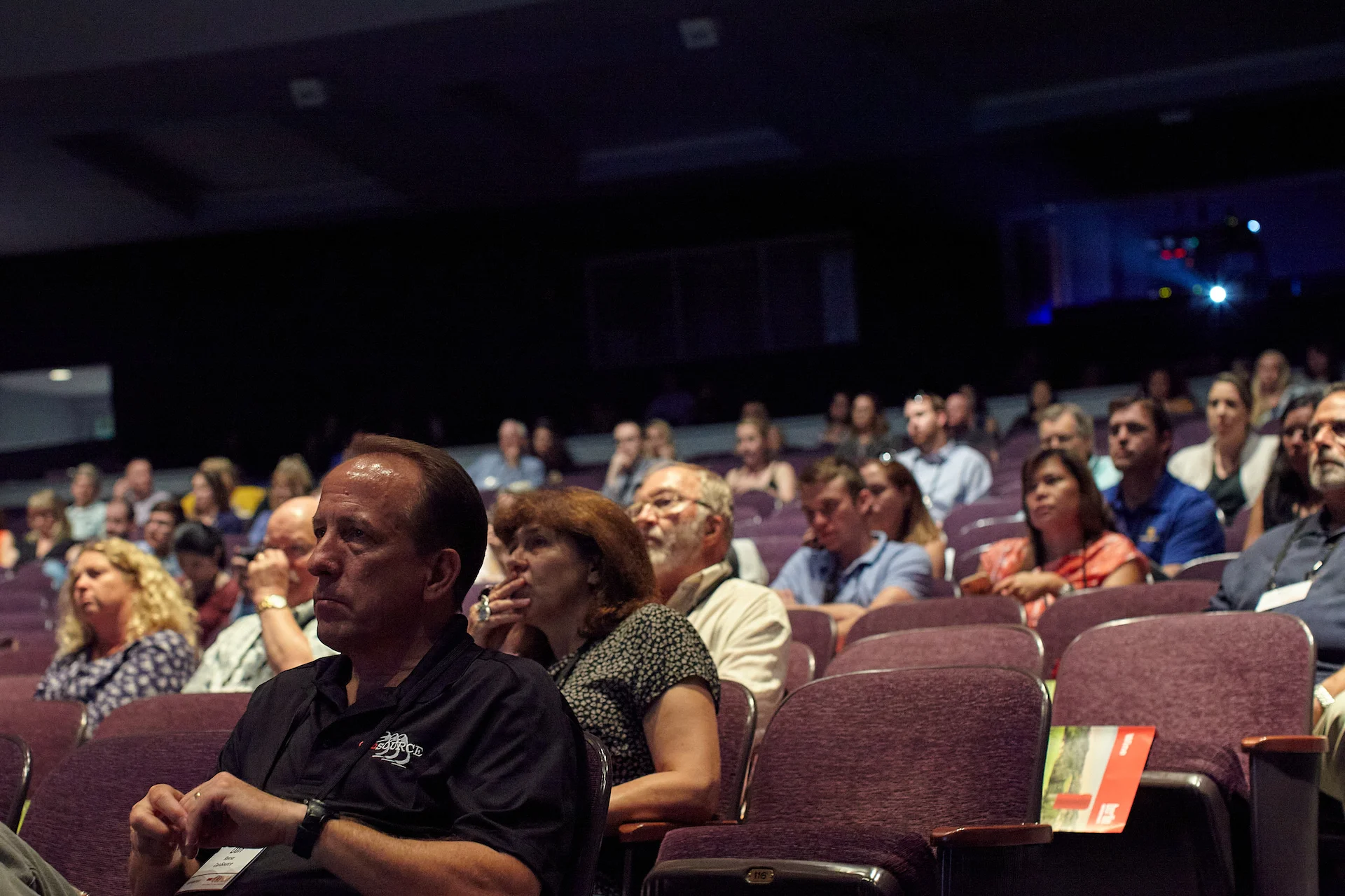 Institutional documentation by San Francisco photographer; an attentive audience during a keynote session at a wine industry conference in Napa, captured on GFX with ambient theater lighting.